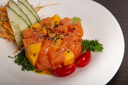 Healthy plate of tropical fruits and salmon. Tropical tartar. Isolated image.の写真素材