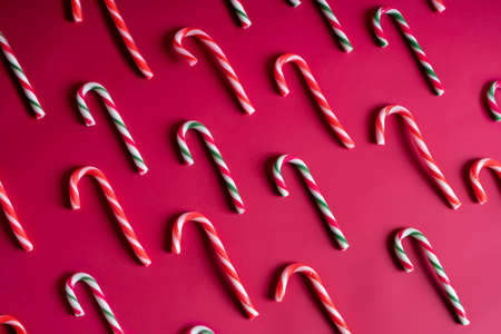 Candy canes on red backgroundの写真素材