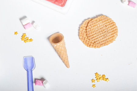 Waffle cookies and clouds of sugar on a white background.の写真素材