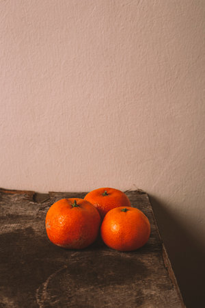 Tangerine, tangerine orange skin on old vintage table. Vertical pictureの写真素材