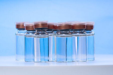 group of glass vials on bluish backgroundの写真素材
