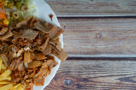 Doner kebab. Grilled beef meat with space for text on wooden background.の写真素材