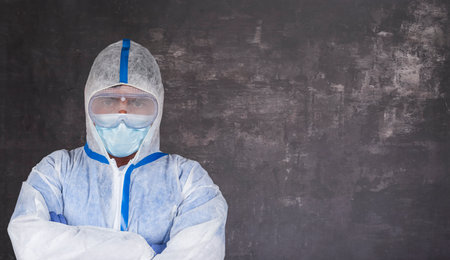 Man with, surgical mask and latex gloves with copy space for textの写真素材