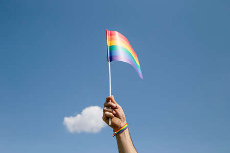Gay flag with the sky in the backgroundの写真素材