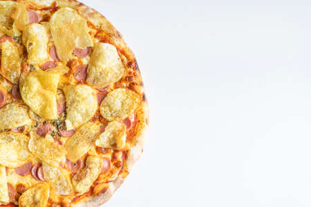 Delicious frankfurter pizza with potato chips on a white background with room for textの写真素材