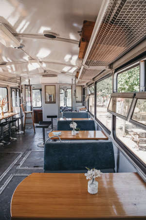 The tables of an old train transformed into a restaurantの写真素材