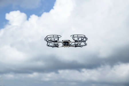 Low Angle View Of Drone Against Cloudy Skyの写真素材