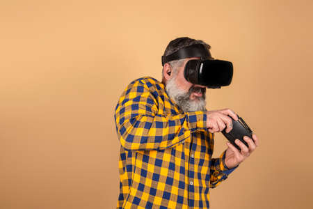 hipster man with virtual reality glasses and game controllerの写真素材