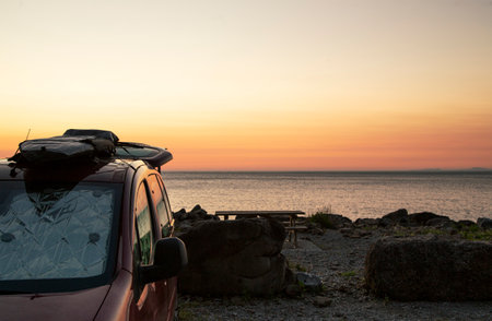 surfboard on the roof of a van, let the road trip begin. Image with copy spaceの写真素材
