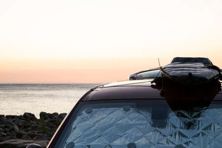 surfboard on the roof of a van, let the road trip beginの写真素材