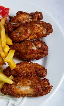 BBQ chicken wings and friesの写真素材