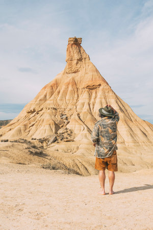 Rear View Of A Traveler Exploring In The Navarre Desertの写真素材