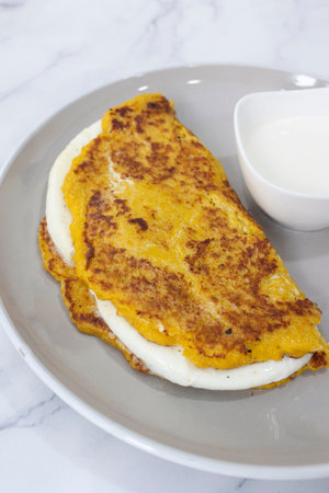 close up Cachapa with cheese, typical Venezuelan dish made with corn, cheese and butterの写真素材