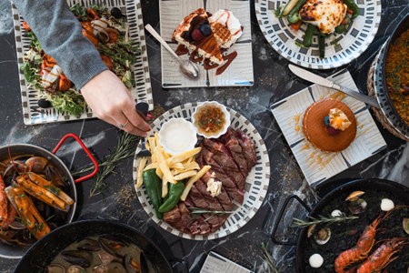 Top view of restaurant table with menu of tasty dishes. Restaurant menu concept.の写真素材