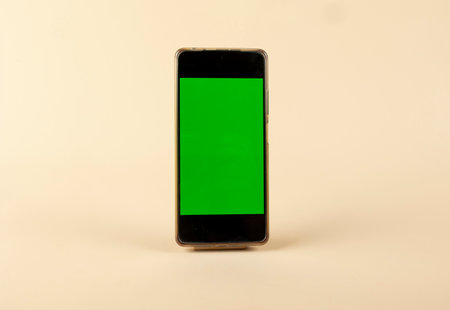 Smart-phone with green screen on pastel color backgroundの写真素材