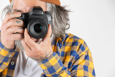 Close-up of a photographer taking a photo on a white or transparent backgroundの写真素材
