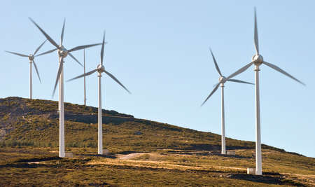 wind energy-Field wind farm in the mountains with blue sky