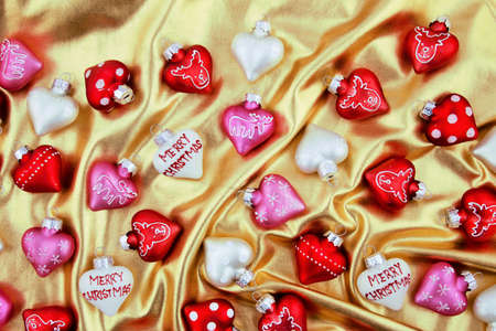 Christmas tree decorations on a golden stuff