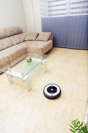 Berlin, Germany, August 29, 2019. irobot roomba cleaning the floor of the room. Vacuum cleaner robot. Household cleaning concept. New technologies.のeditorial素材