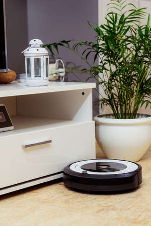 Berlin, Germany, August 29, 2019. irobot roomba cleaning the floor of the room. Vacuum cleaner robot. Household cleaning concept. New technologies.のeditorial素材