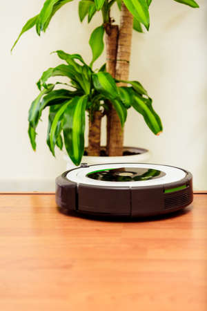 Berlin, Germany, August 29, 2019. irobot vacuum cleaner roomba cleaning the edge of a step thanks to its fall protection sensors.のeditorial素材