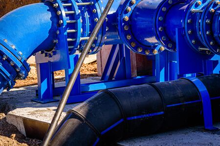 valve on 500mm drink water pipes joined with multi joint members into old pipeline system. Control check of finished repaired piping before covering by clayの写真素材