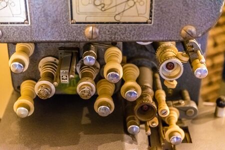 Old movie projector for cinema. Vintage movie camera keep in museum. It is use with retro film. But the body is classic design. The vintage cinema projector is analog and difficult to use it.の写真素材