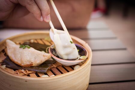 A big assortment of Thai foods and appetizers presented beautifully with fancy garnish.の写真素材
