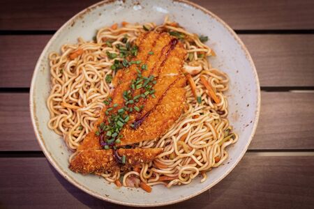 A big assortment of Thai foods and appetizers presented beautifully with fancy garnish.の写真素材