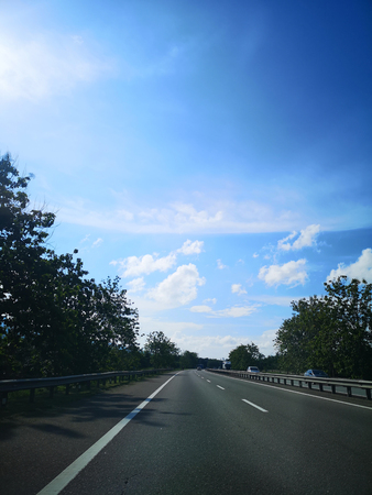 Highway with blue skiesの写真素材