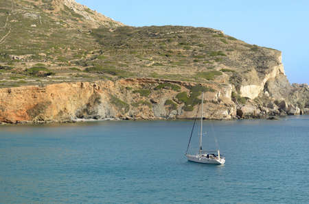 A sailboat sailing near the beach Agkali の写真素材