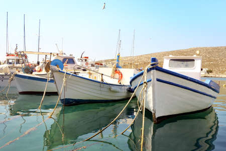 Fishing boats moored in the harbor の写真素材