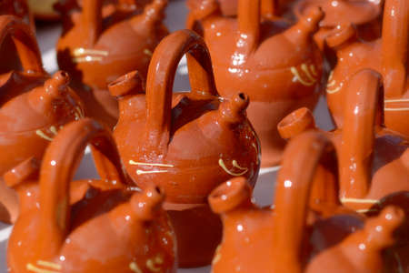 Mud botijos for sale in a marketの写真素材