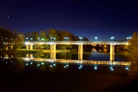 Dusk on the iron bridge on the river Ebroの写真素材