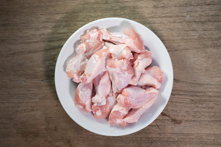 Raw chicken wings in a bow prepare for cooking.の写真素材