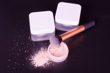 Face powder, brush, night and day creamsの写真素材