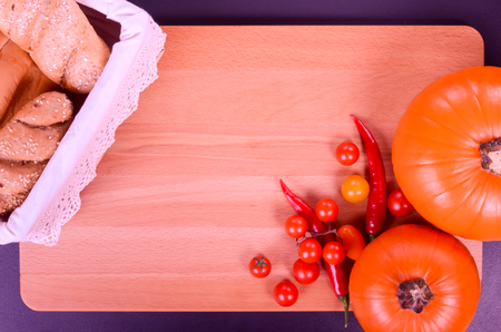 Fresh bread and pumpkin in a rustic styleの写真素材