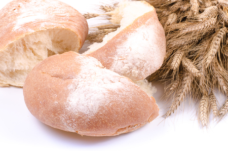 Bakery Bread with sheaf of Wheat Ears on white backgroundの写真素材