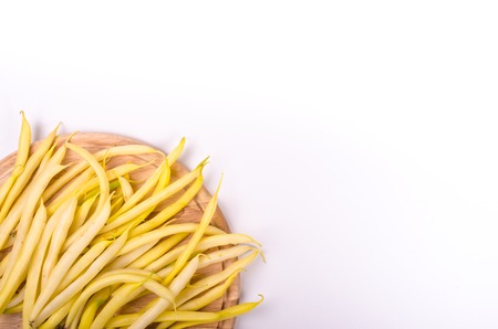 Yellow beans on a white background. Vagetable frame