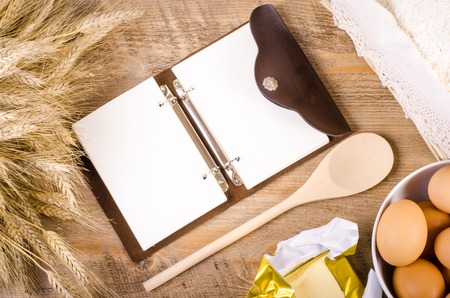 Baking background with ears of wheat, flour, eggs and butter. Free space for textの写真素材