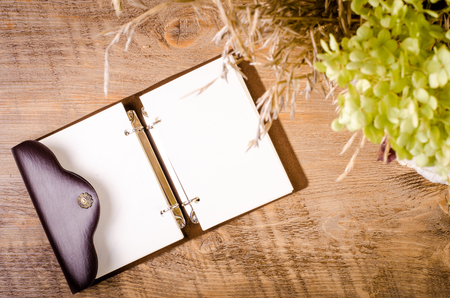 Autumn bouquet  with diary on wooden table. Free space for textの写真素材