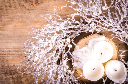 Christmas wreath and candles, New Year decoration on woodenの写真素材