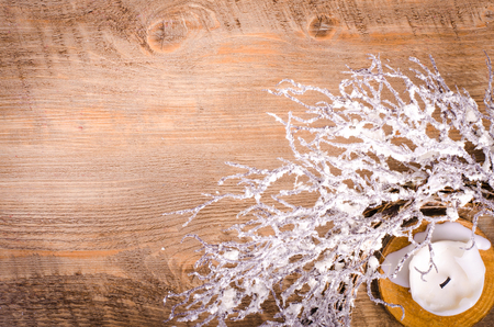 Christmas wreath and candle, New Year decoration on woodenの写真素材