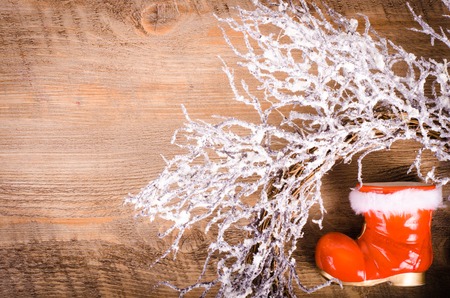 Christmas snowy wreath and Santa Claus boots, New Year decoration. Free space for text.の写真素材