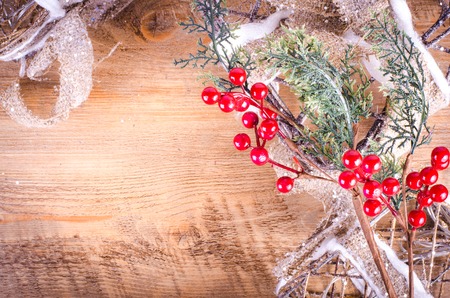 Christmas rustic light boxes on wooden background, snowy wreath. Christmas and New Year decoration frame. Free space for text.の写真素材