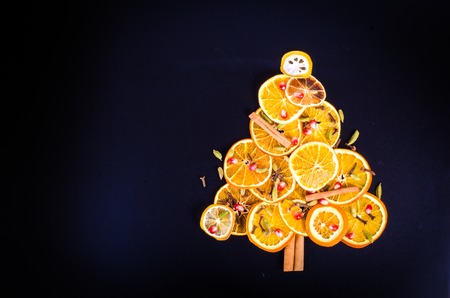 Christmas tree made of dried oranges, cinnamon and anise. Viewed from above.の写真素材