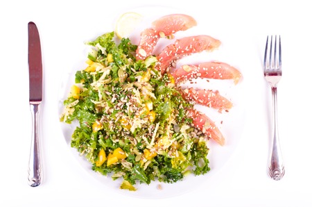 Salt salmon with fresh salad in white porcelain plateの写真素材