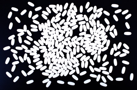 Capsule berryBlack capsules blueberry isolated on white backgroundの写真素材