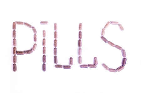 A number of tablets distributed on a light backgroundの写真素材