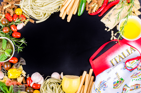 Ingridients for traditional italian dishes on black background. Free space for your textの写真素材